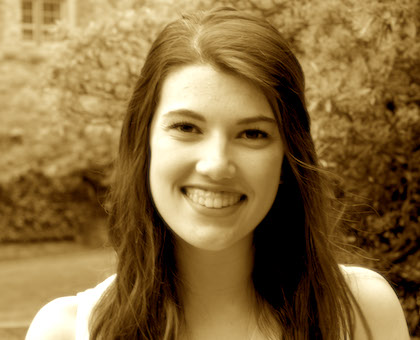 Emma Spickard smiling in front of trees