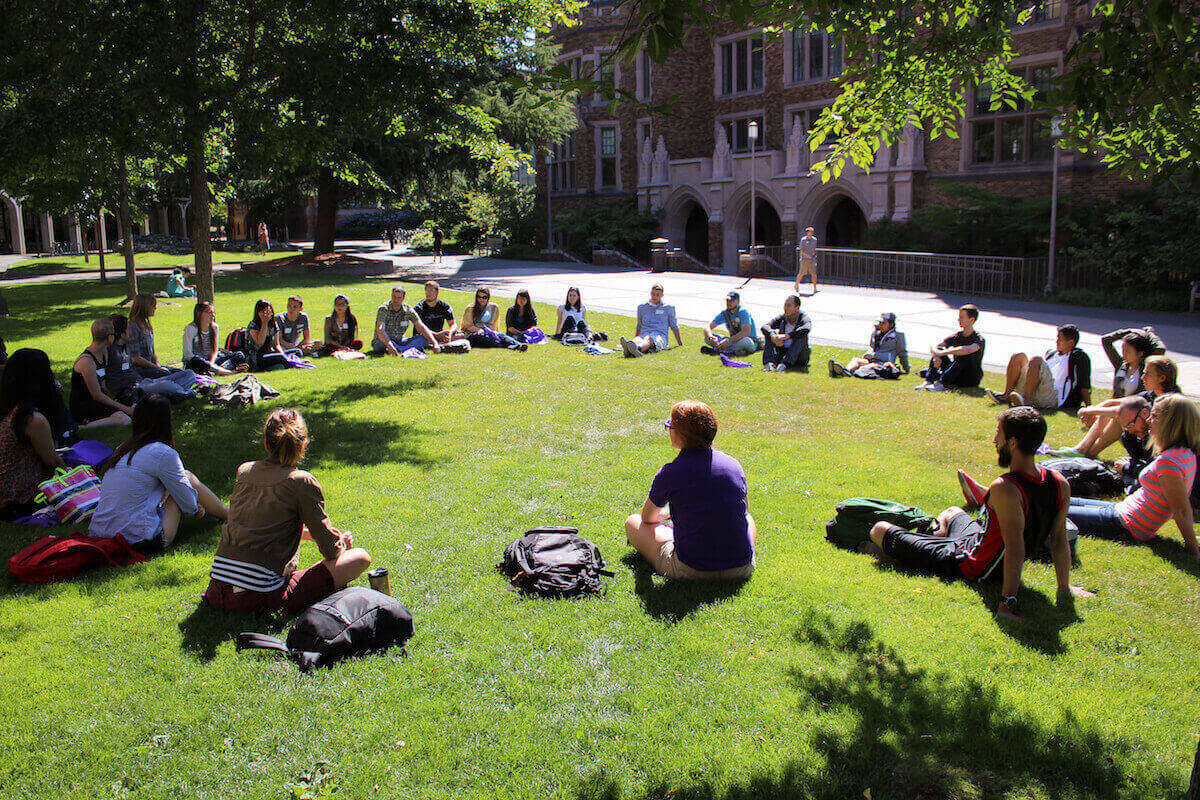 An outdoor class in front of Mary Gates Hall