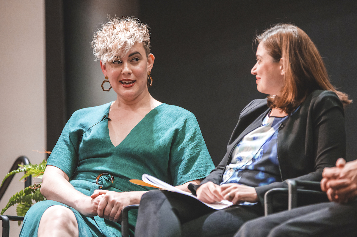 Anna Lauren Hoffman quriks an eyebrow while responding, Ece Kamar smiles at her response