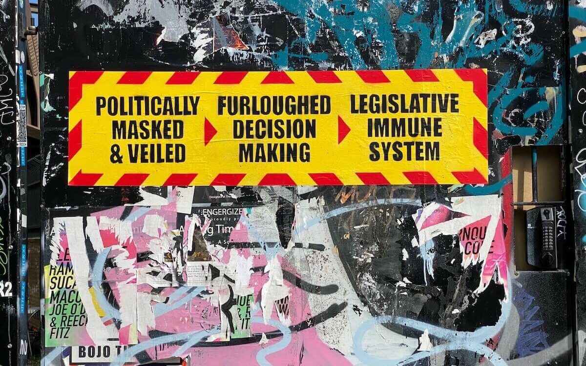 Street art in Times Square demonstrates mistrust of government motives and processes